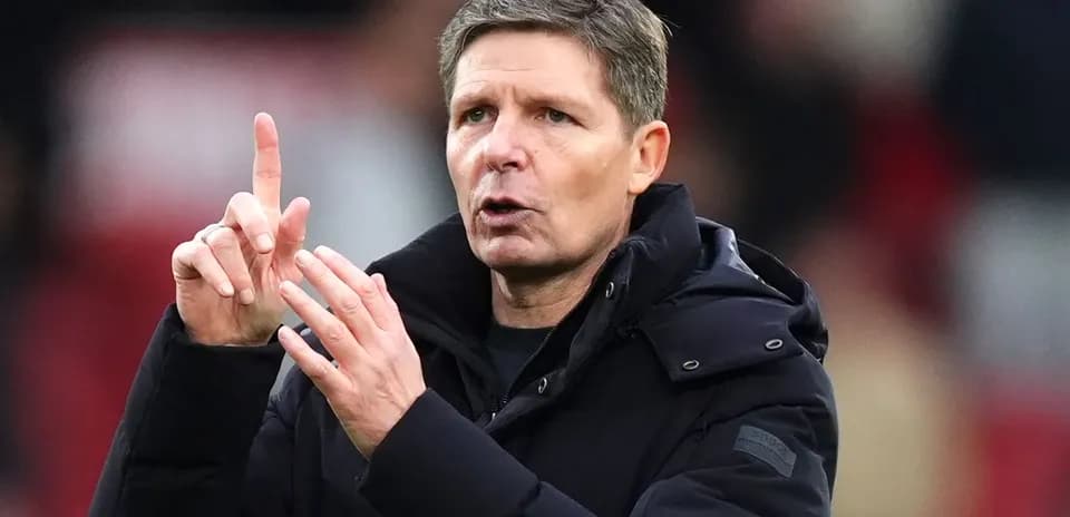 Coach gesturing during a match on the sidelines
