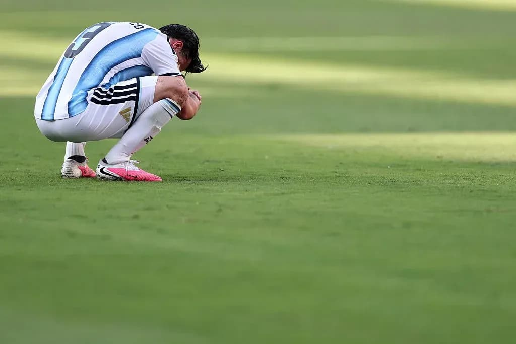 Player kneeling on the field after a match