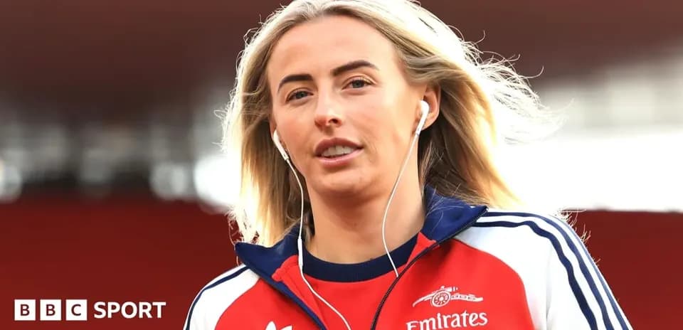 Athlete wearing headphones walking on pitch