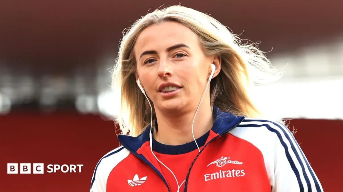 Athlete wearing headphones walking on pitch