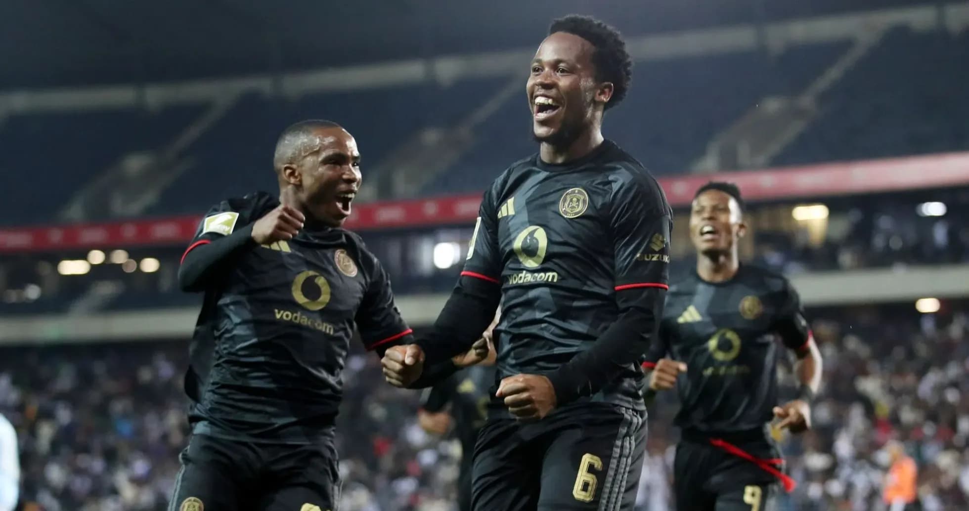 Players celebrating a goal during a match