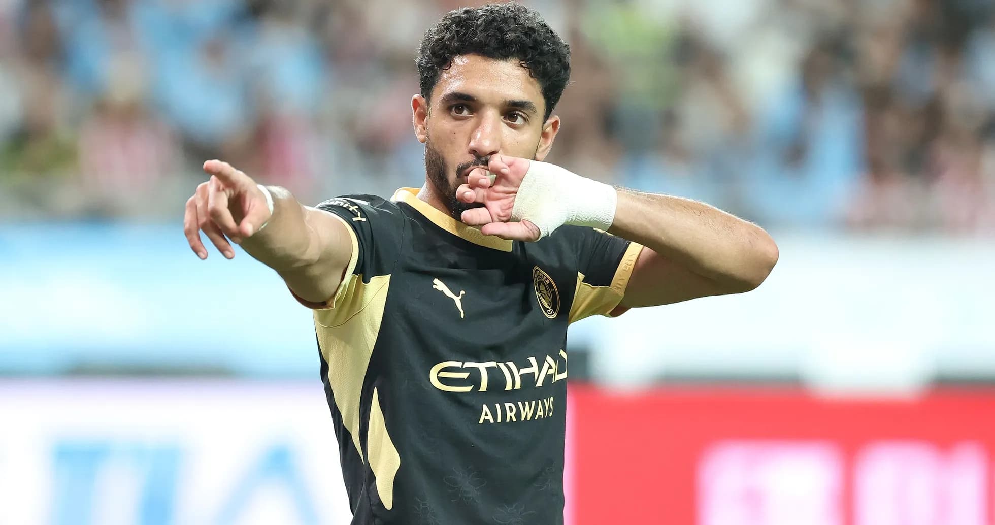 Player gesturing during a football match celebration