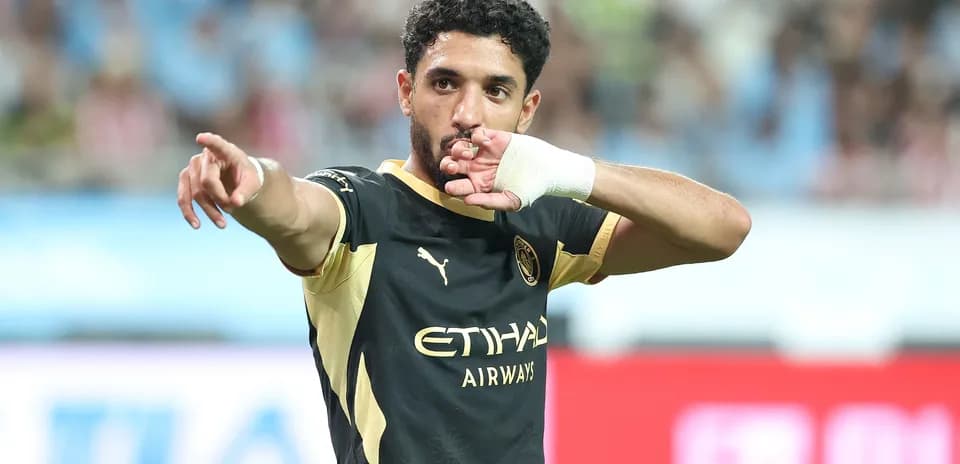 Player gesturing during a football match celebration