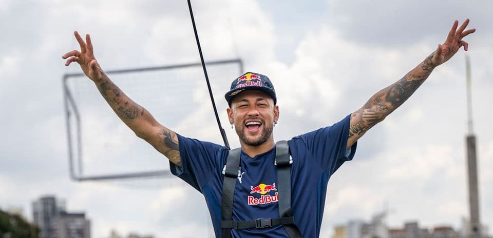 Player celebrating with arms raised outdoors