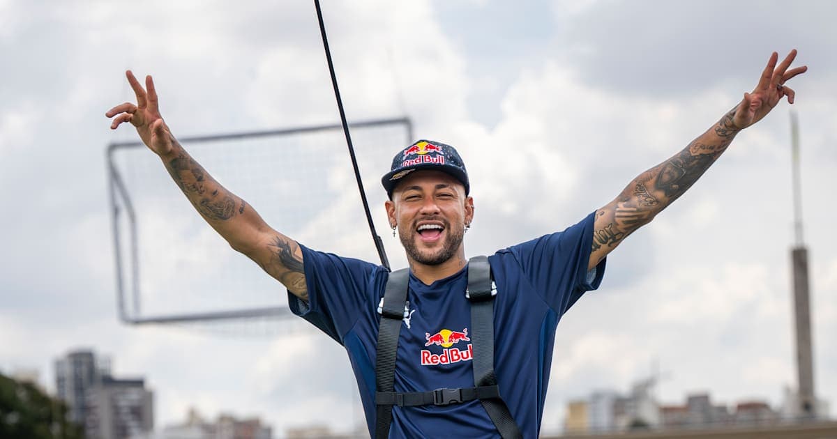 Player celebrating with arms raised outdoors