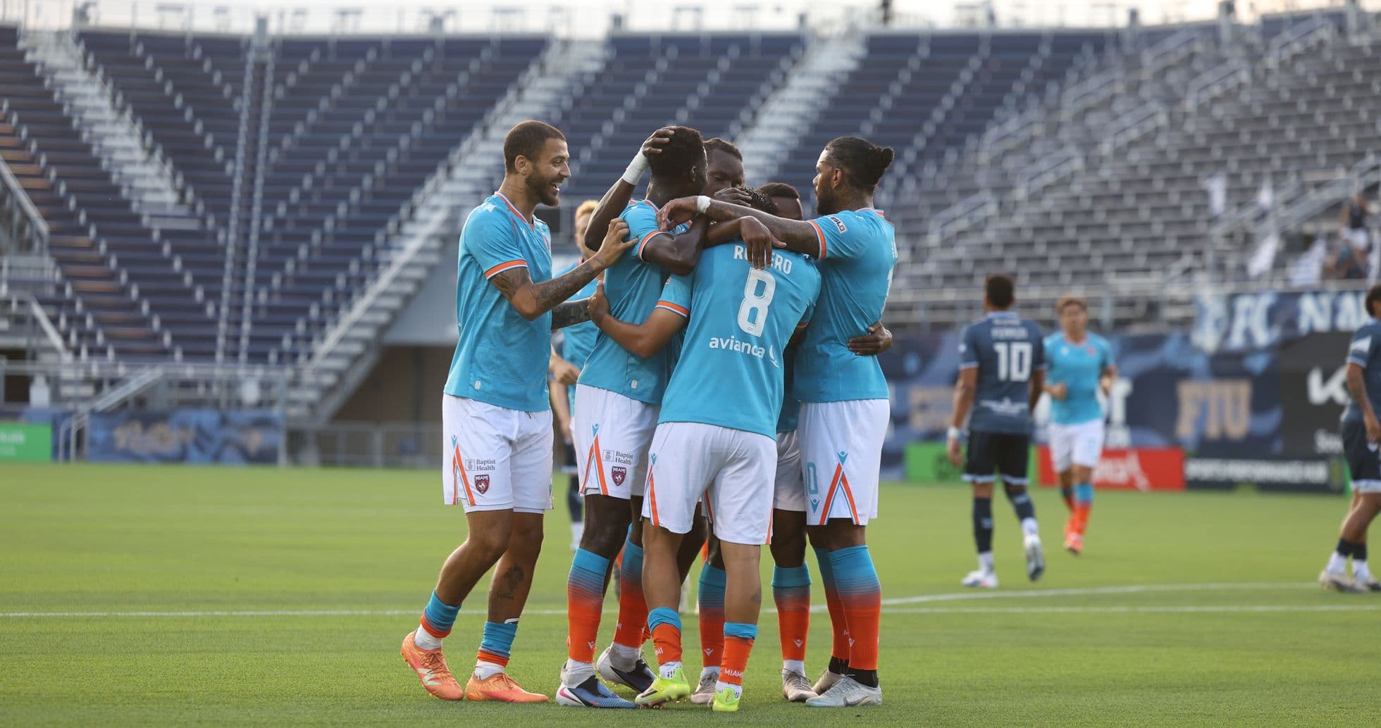 Miami FC players celebrating a goal