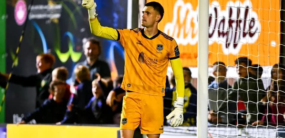 Goalkeeper signaling during a soccer match