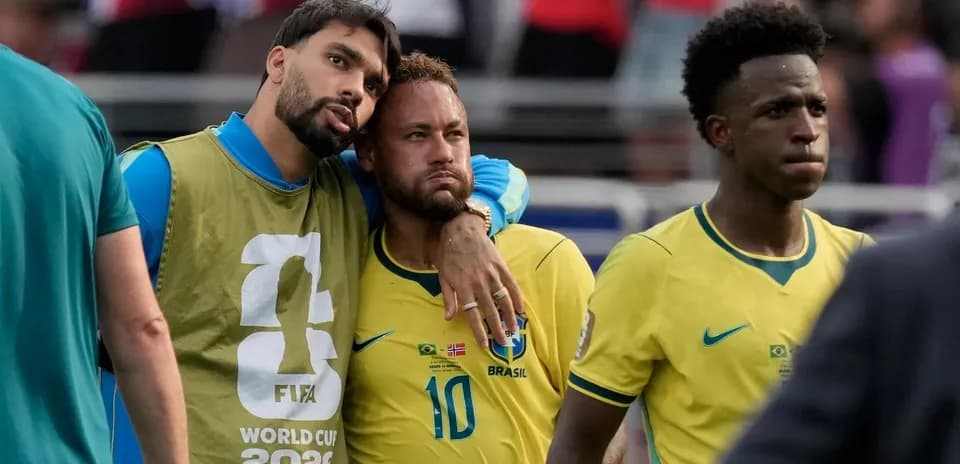 Brazilian players in yellow jerseys after match