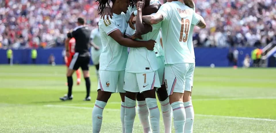French team celebrating a goal on the field
