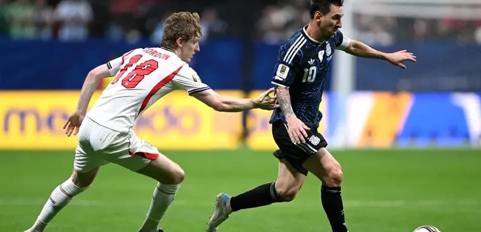 Player in blue jersey evading opponent during match