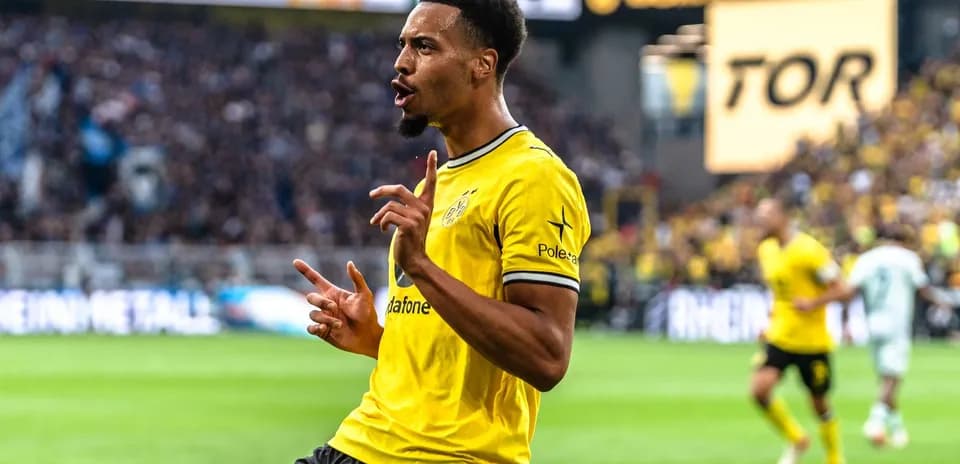 Player celebrating a goal in yellow jersey