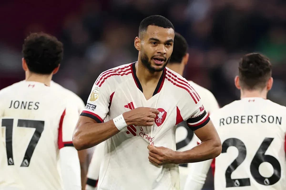 Liverpool player adjusting his shirt during match
