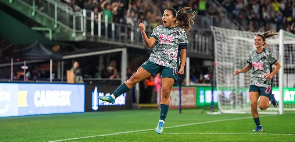 Player celebrating goal during Seattle Reign FC match