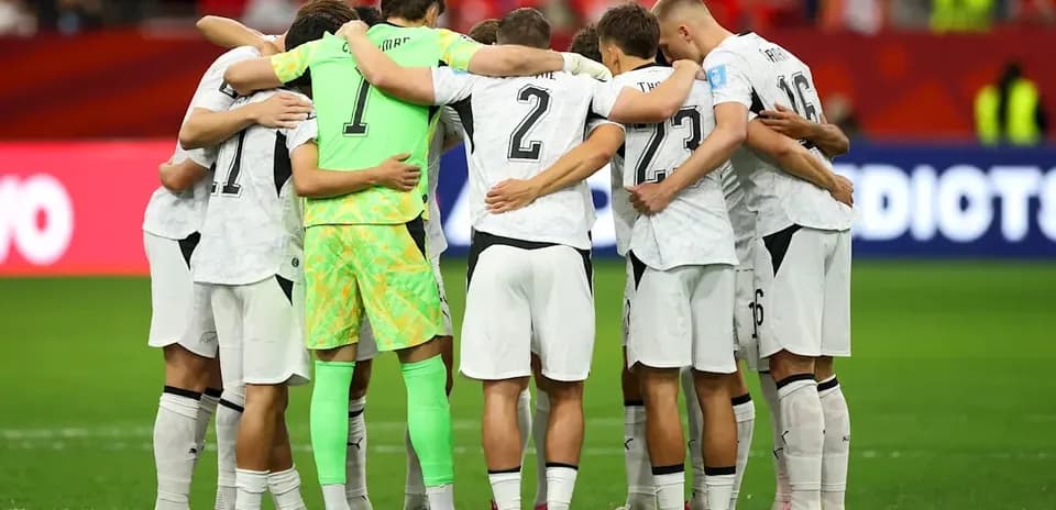 Team huddle before the match on the field
