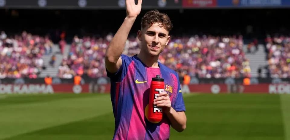 Player waving while holding a water bottle