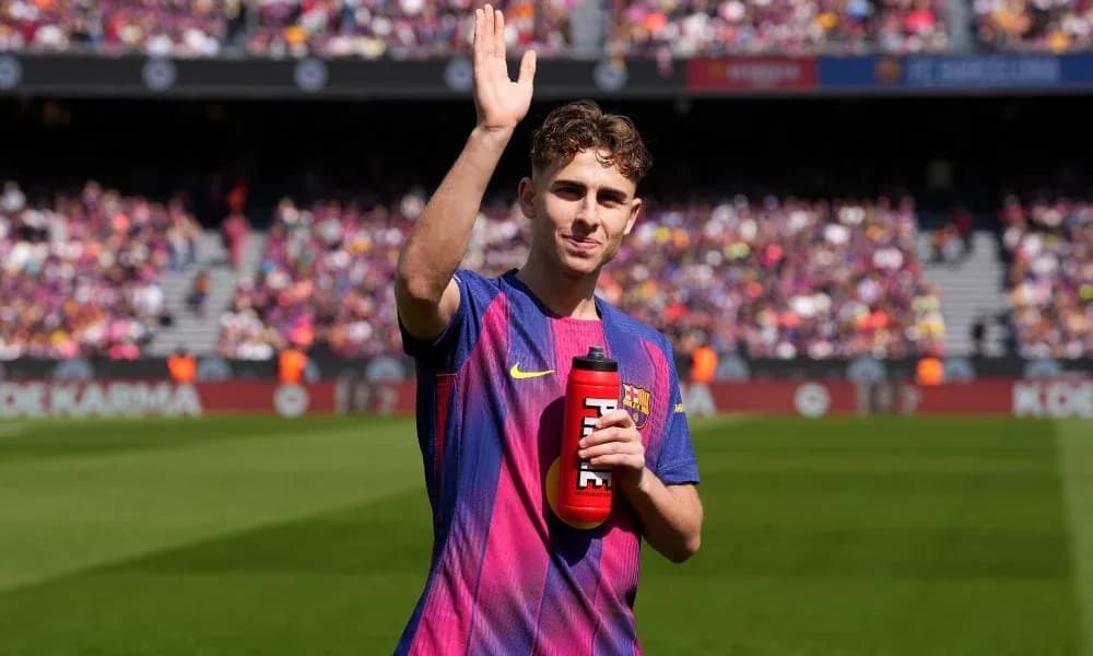 Player waving while holding a water bottle