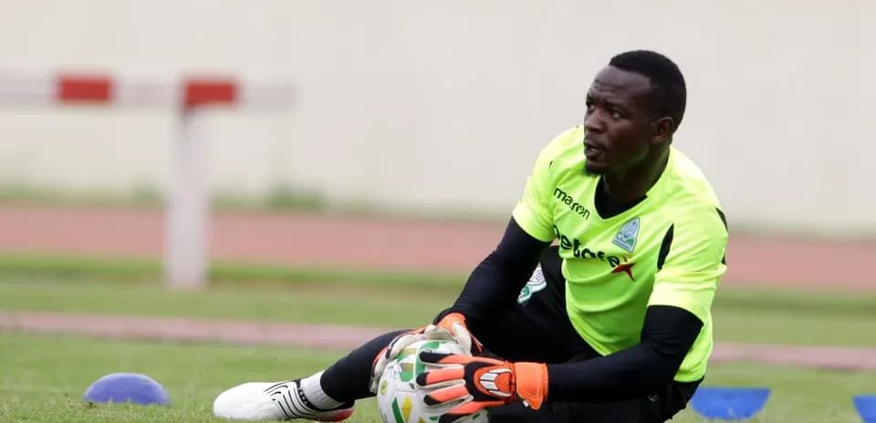 Goalkeeper training on the pitch with ball