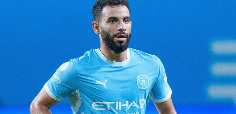 Player in Manchester City kit on the pitch