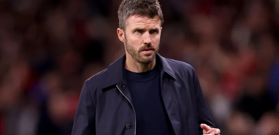 Coach walking along the sideline during match