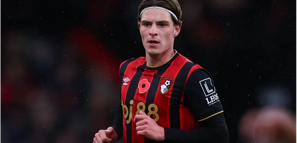AFC Bournemouth player in red and black kit