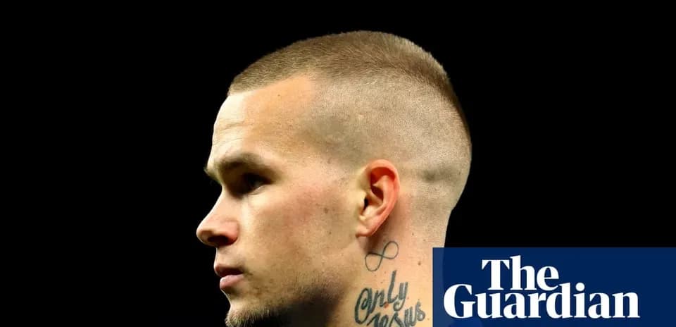 Profile of a player with a tattoo on neck
