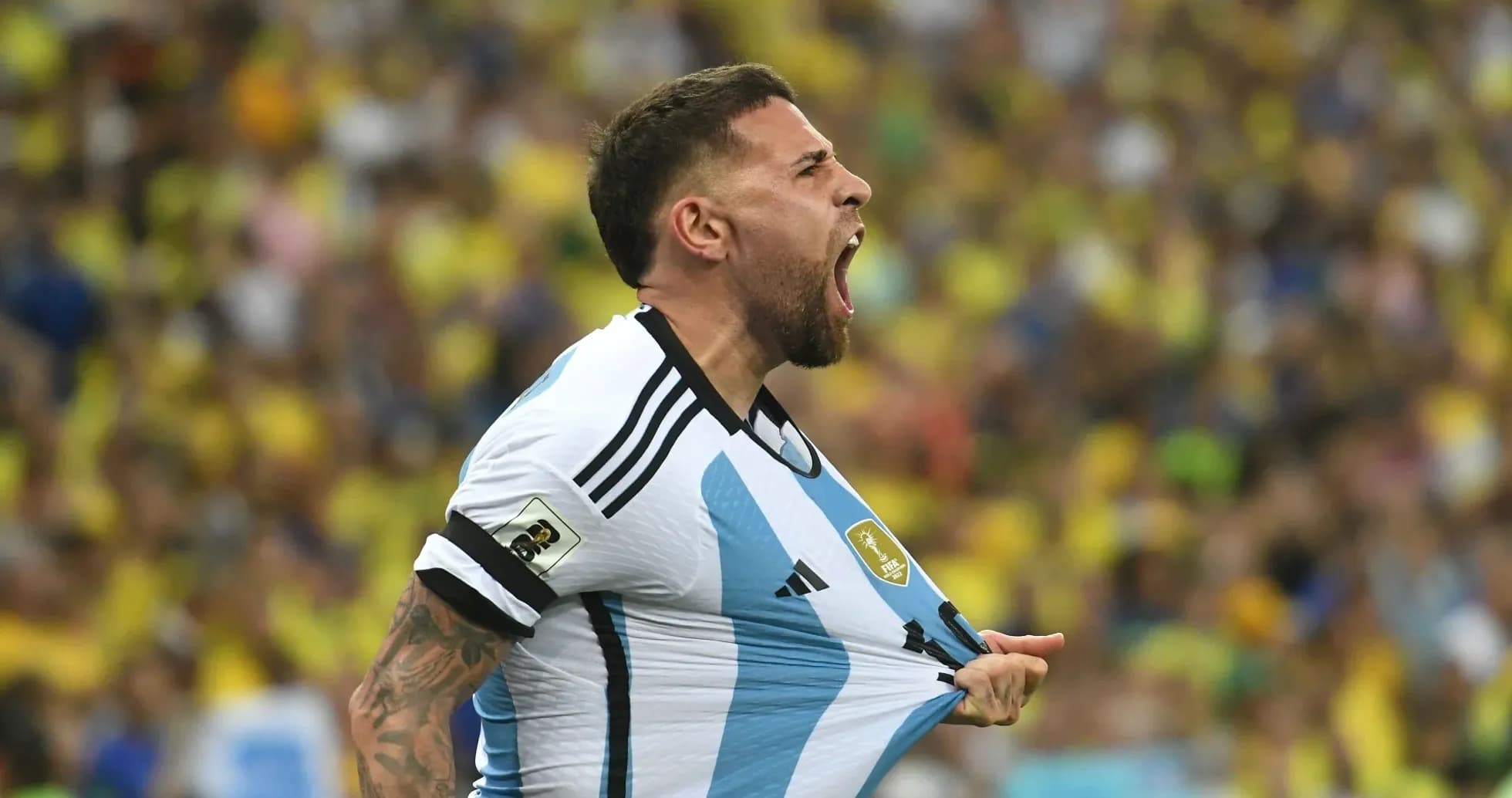 Player celebrating while pulling his jersey during match