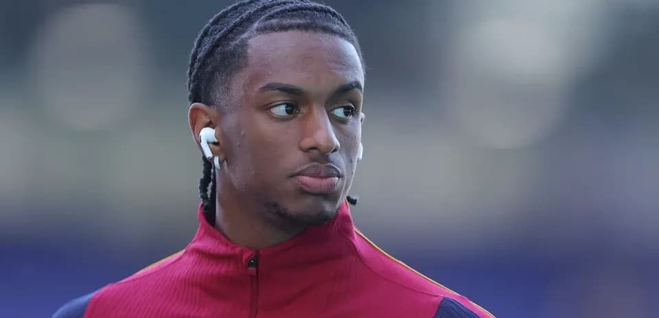 Player wearing earbuds before a match