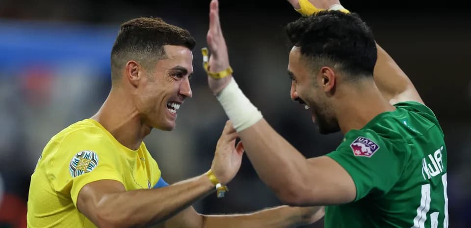 Two players celebrating after a match victory