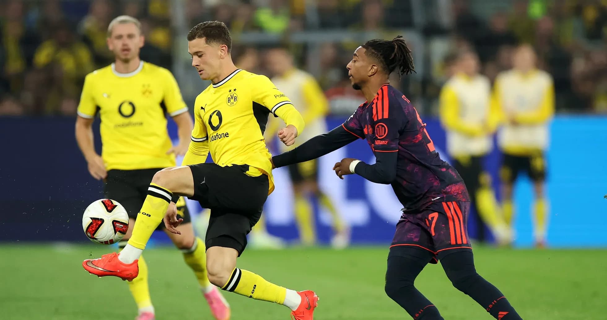 Player from Borussia Dortmund dribbling past opponent