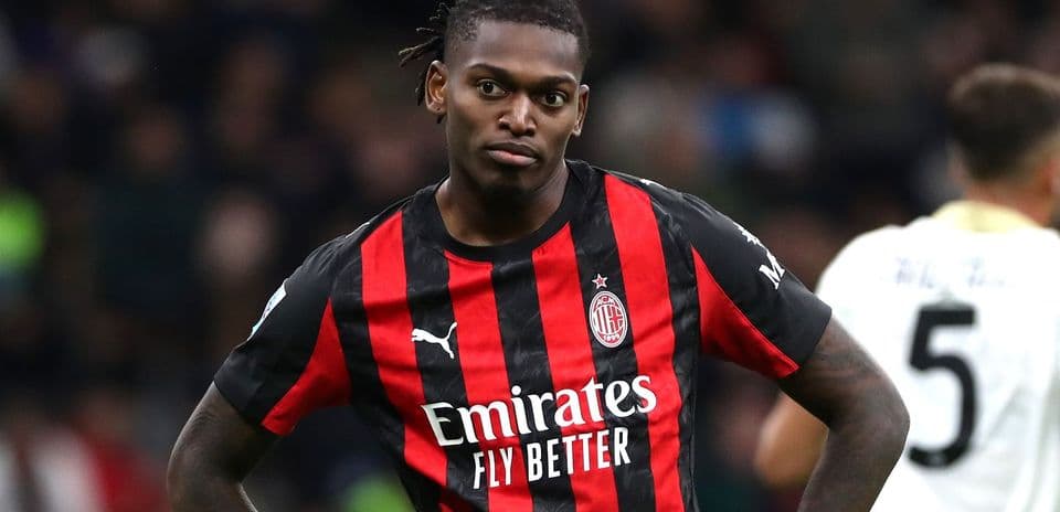 Player in AC Milan jersey on the field