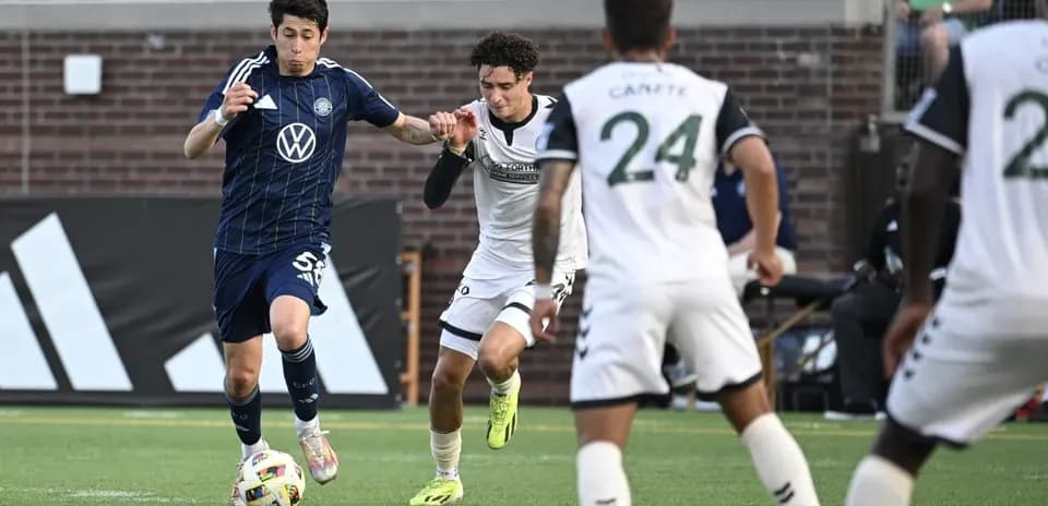 Player competing for the ball in MLS Next Pro match
