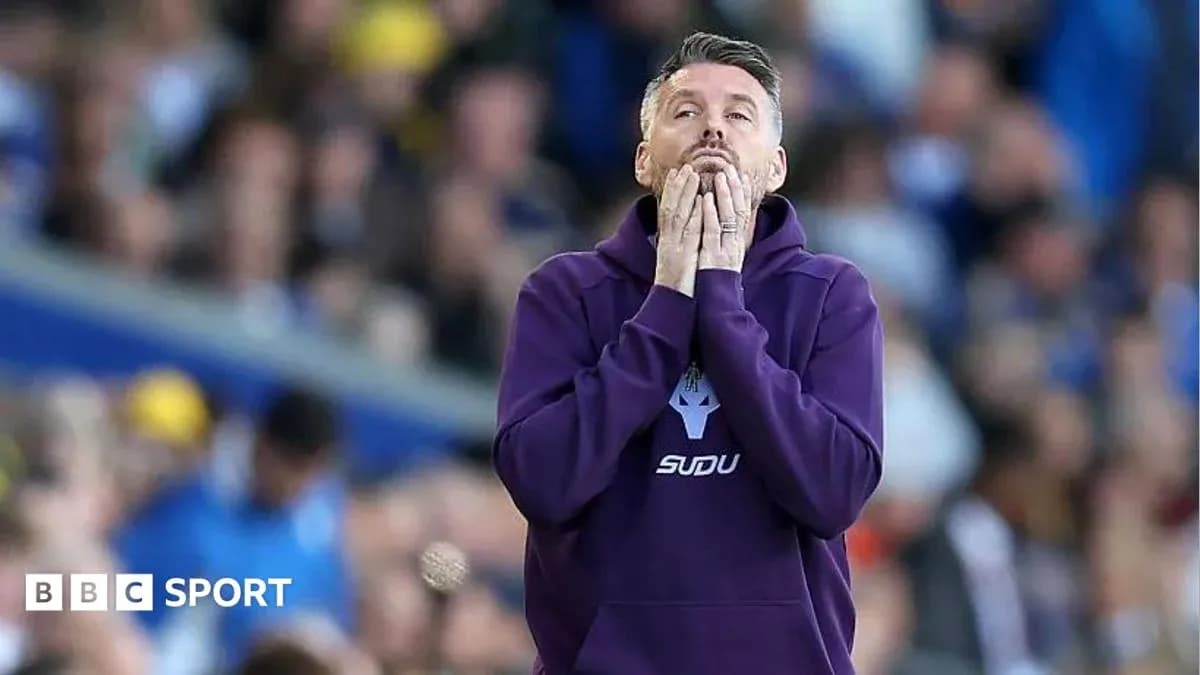 Coach showing concern during match on the sidelines