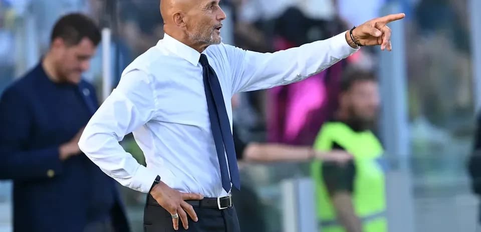 Coach gesturing from the sideline during match