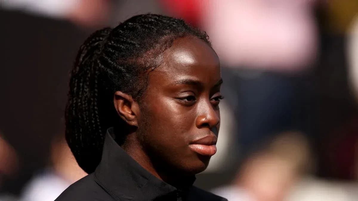 Athlete with braided hair during event preparation