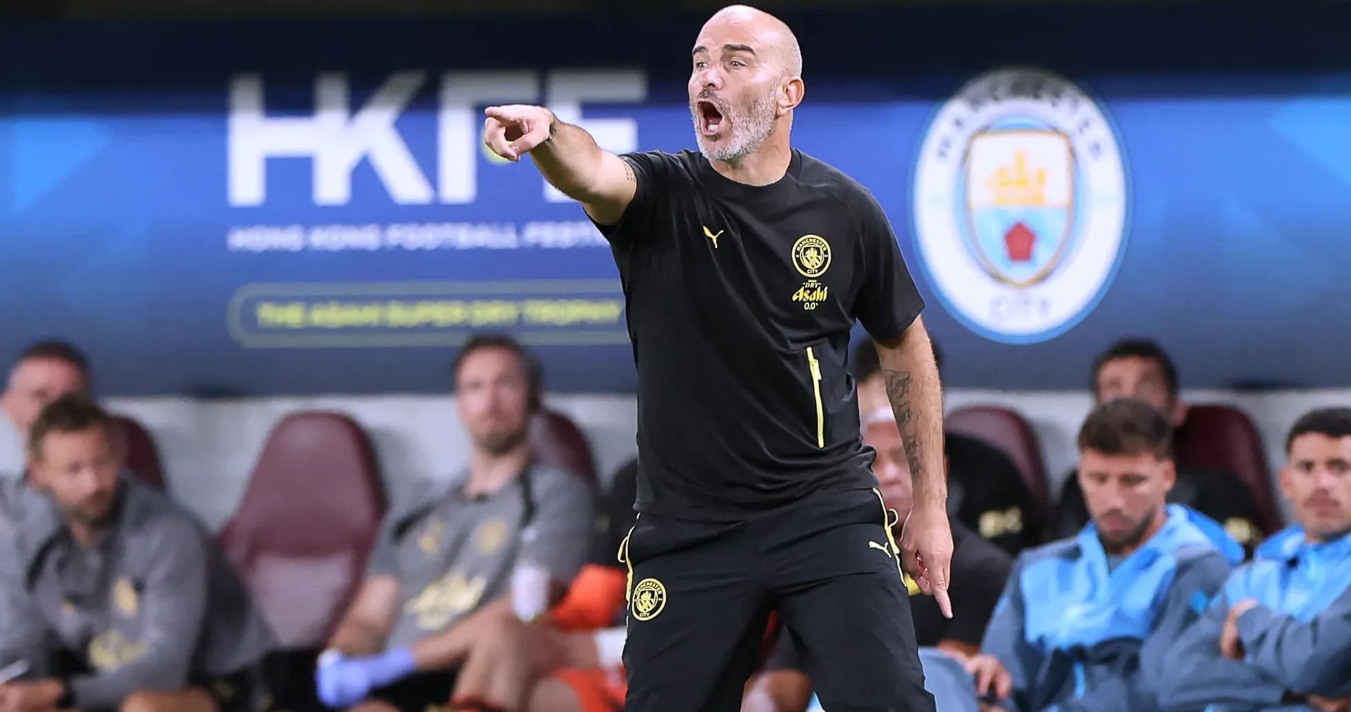 Coach giving instructions from the sideline during match