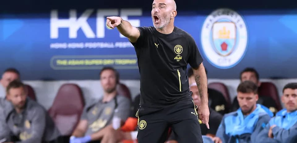 Coach giving instructions from the sideline during match