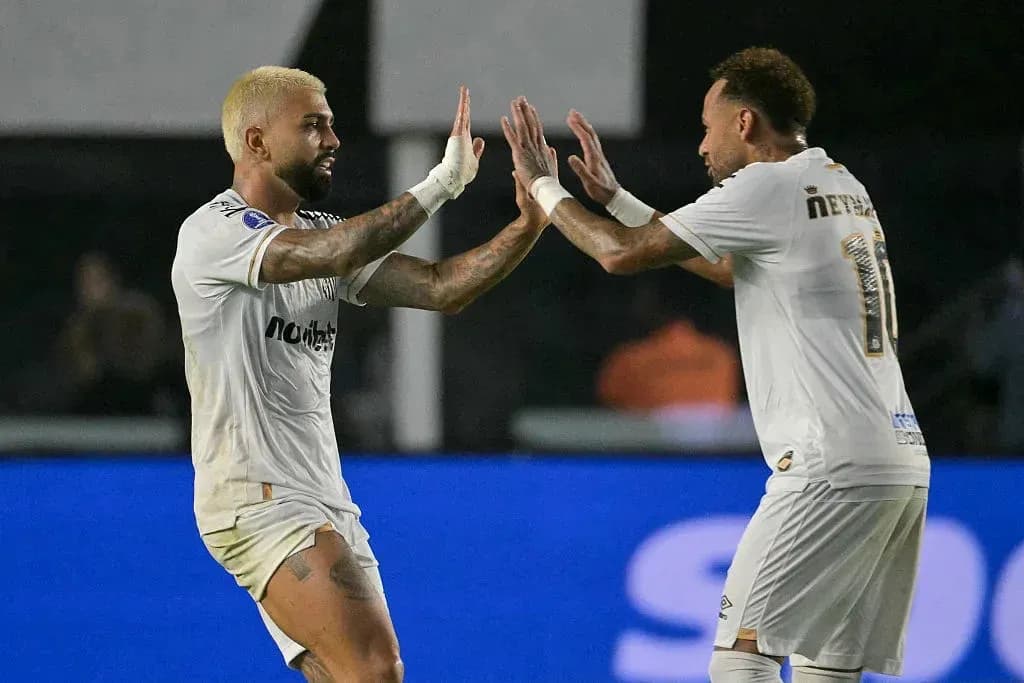 Two players celebrating a goal on the field