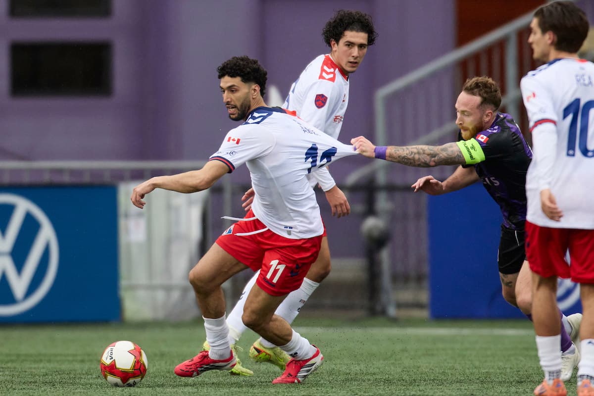 Players competing for the ball during match
