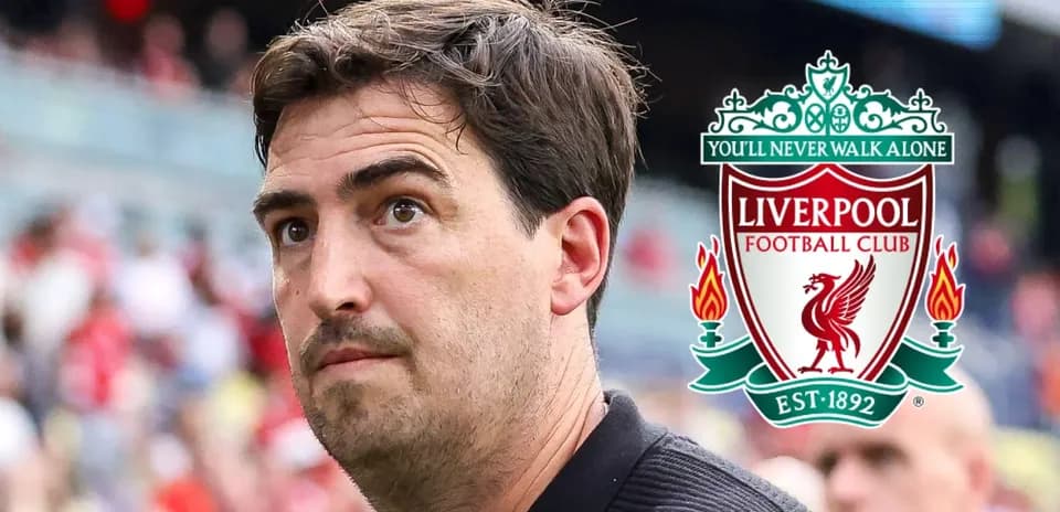 Coach near Liverpool FC logo during match