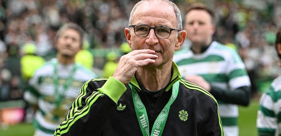 Manager with glasses on field during celebration