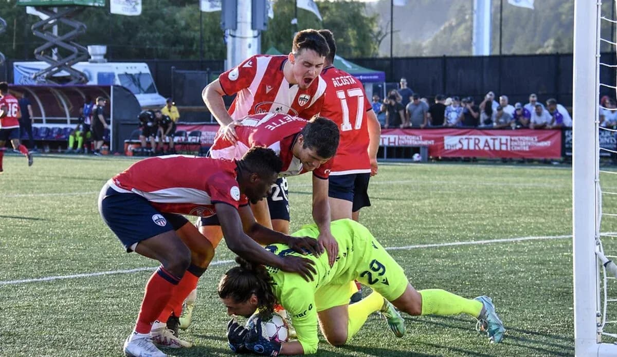 Players celebrating after a goal during match
