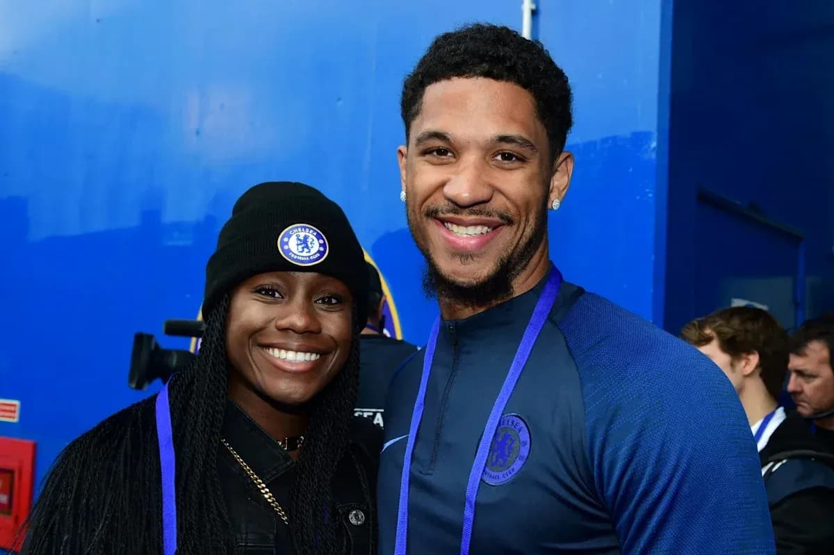 Two people posing together in Chelsea attire