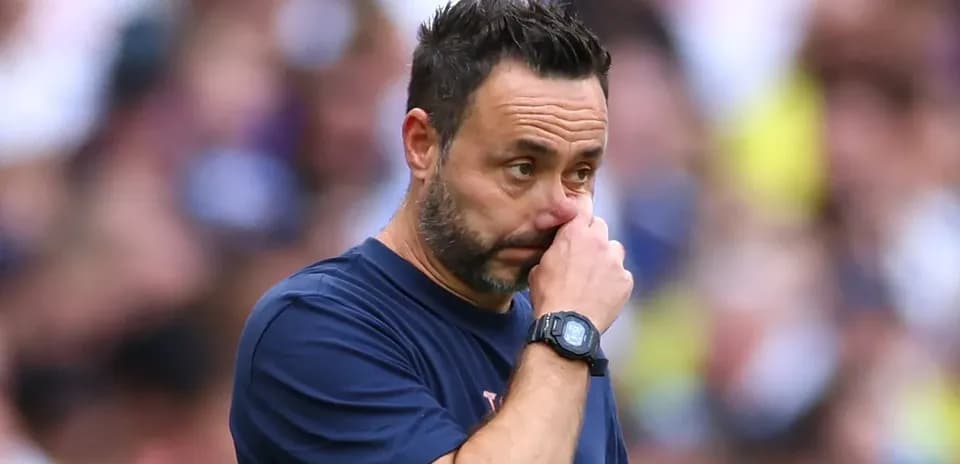 Coach touching his nose during a match