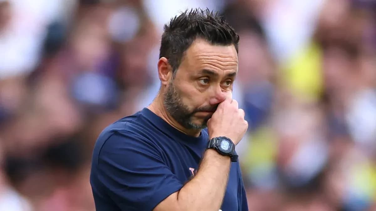 Coach touching his nose during a match