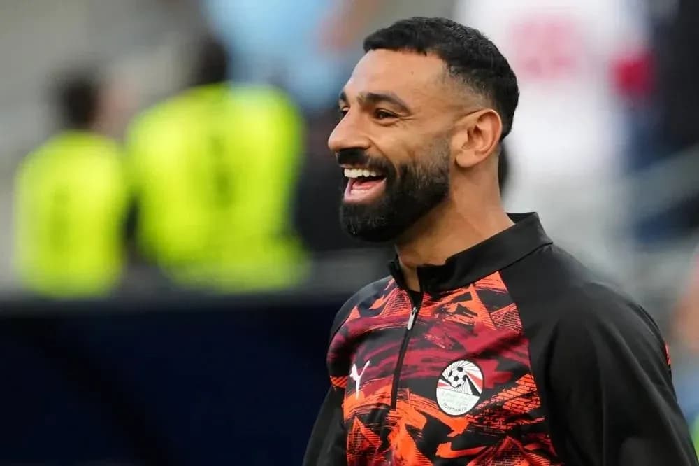 Player smiling during warm-up session on field