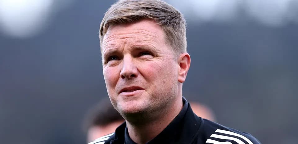 Football manager speaking during training session