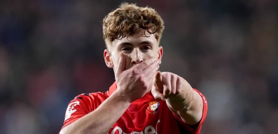 Player celebrating with a hand gesture on field