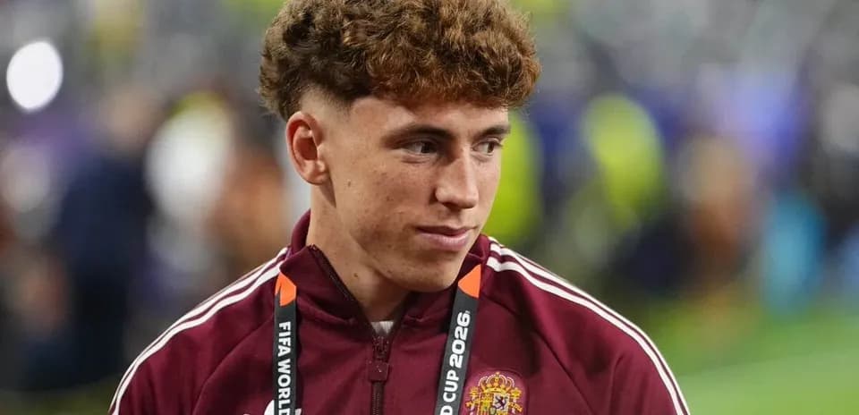 Player in maroon jacket at FIFA World Cup event