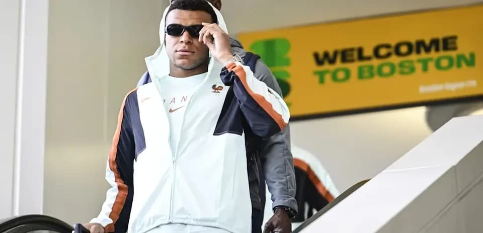 Player arriving at Boston airport with suitcase