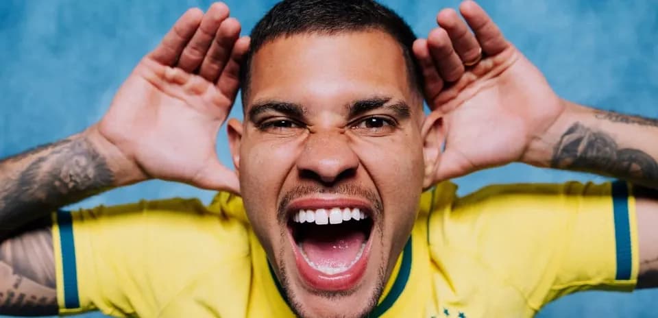 Player in Brazil jersey making a playful expression